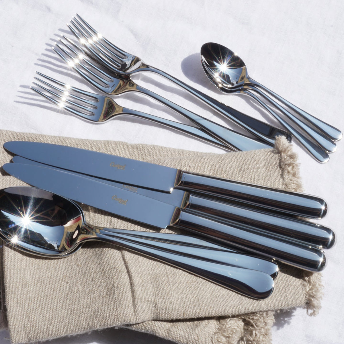 Cutlery set with 24 polished pieces by Cutipol Atlantico featuring premium materials