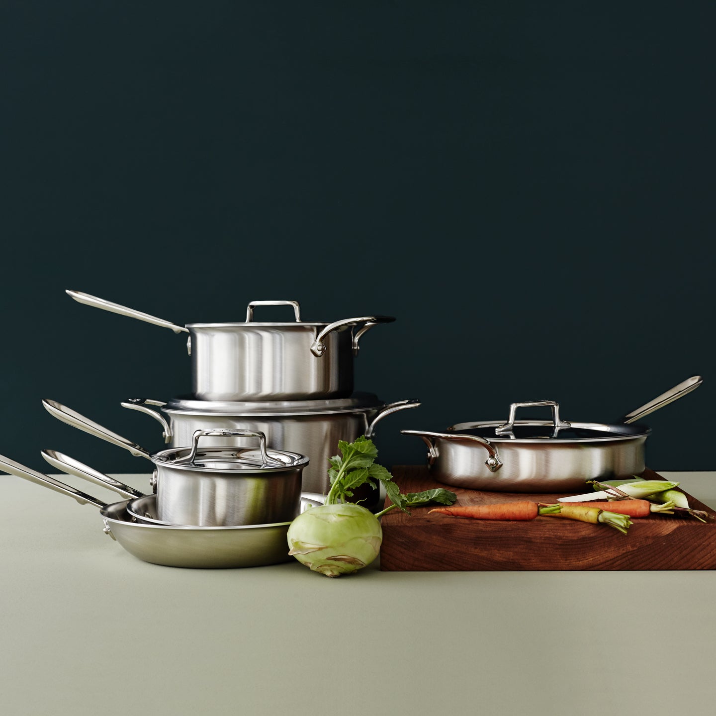 Close-up of All-Clad D5 6-piece stainless steel cookware set, showcasing excellent craftsmanship and design