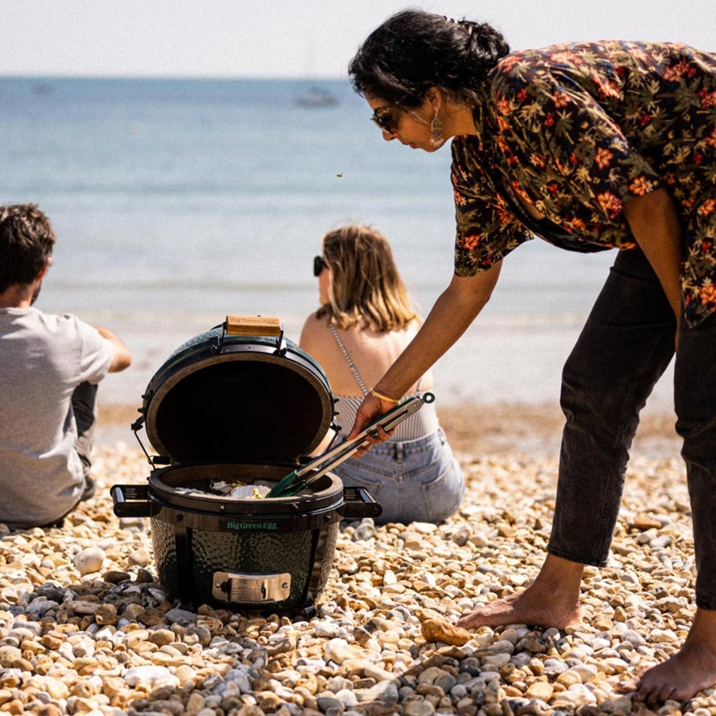 Big Green Egg Mini-Max Portable Ceramic Kamado Grill with Stand in a compact storage position