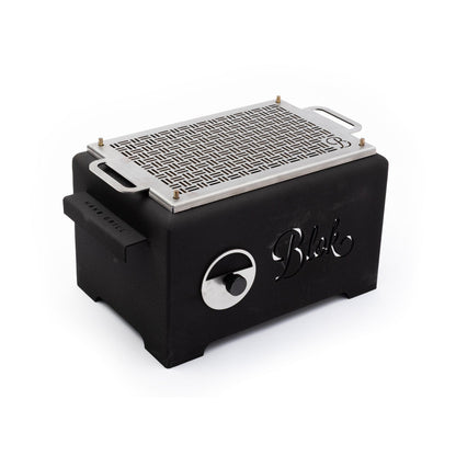Compact tabletop grill in sleek black design for outdoor use