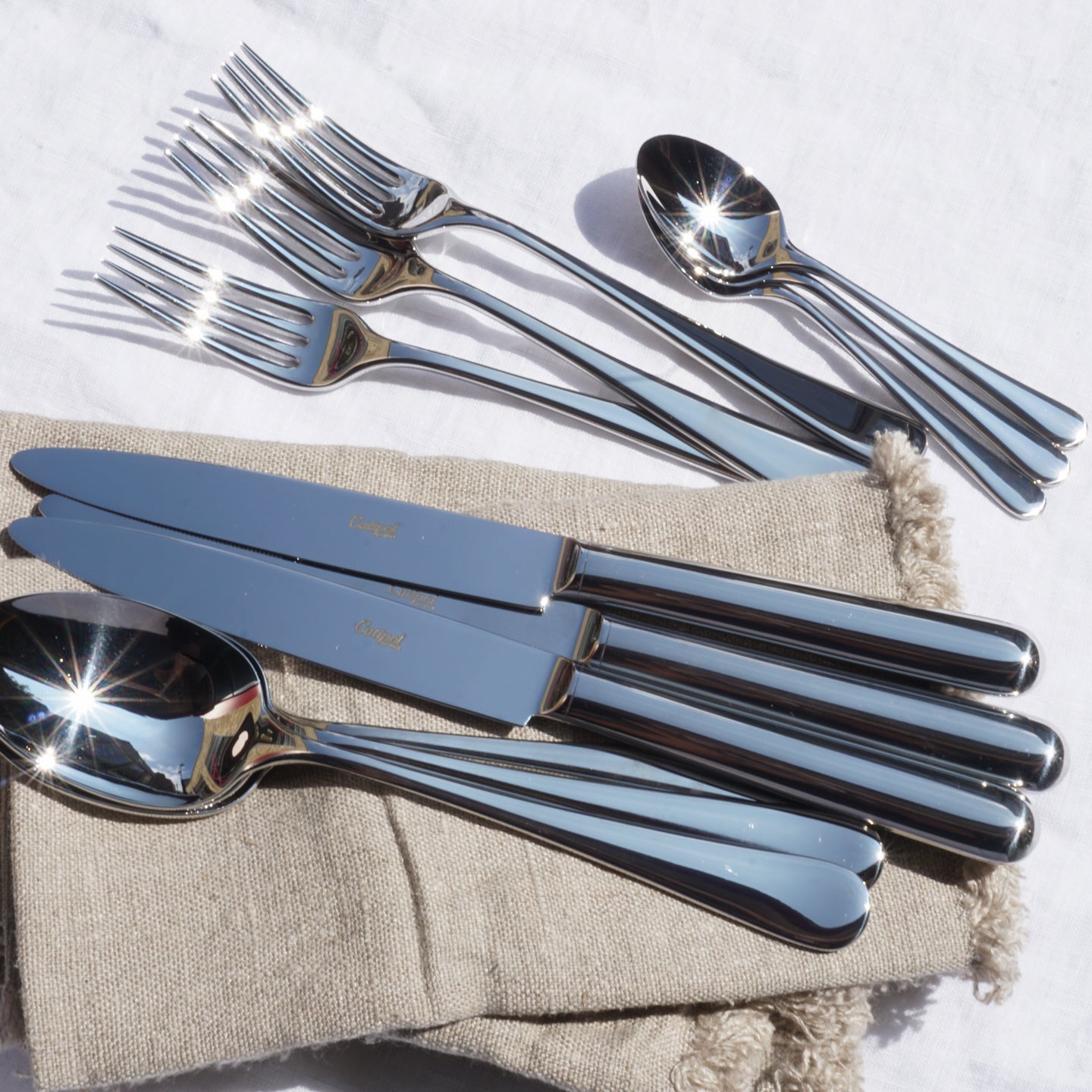 Cutlery set with 24 polished pieces by Cutipol Atlantico featuring premium materials