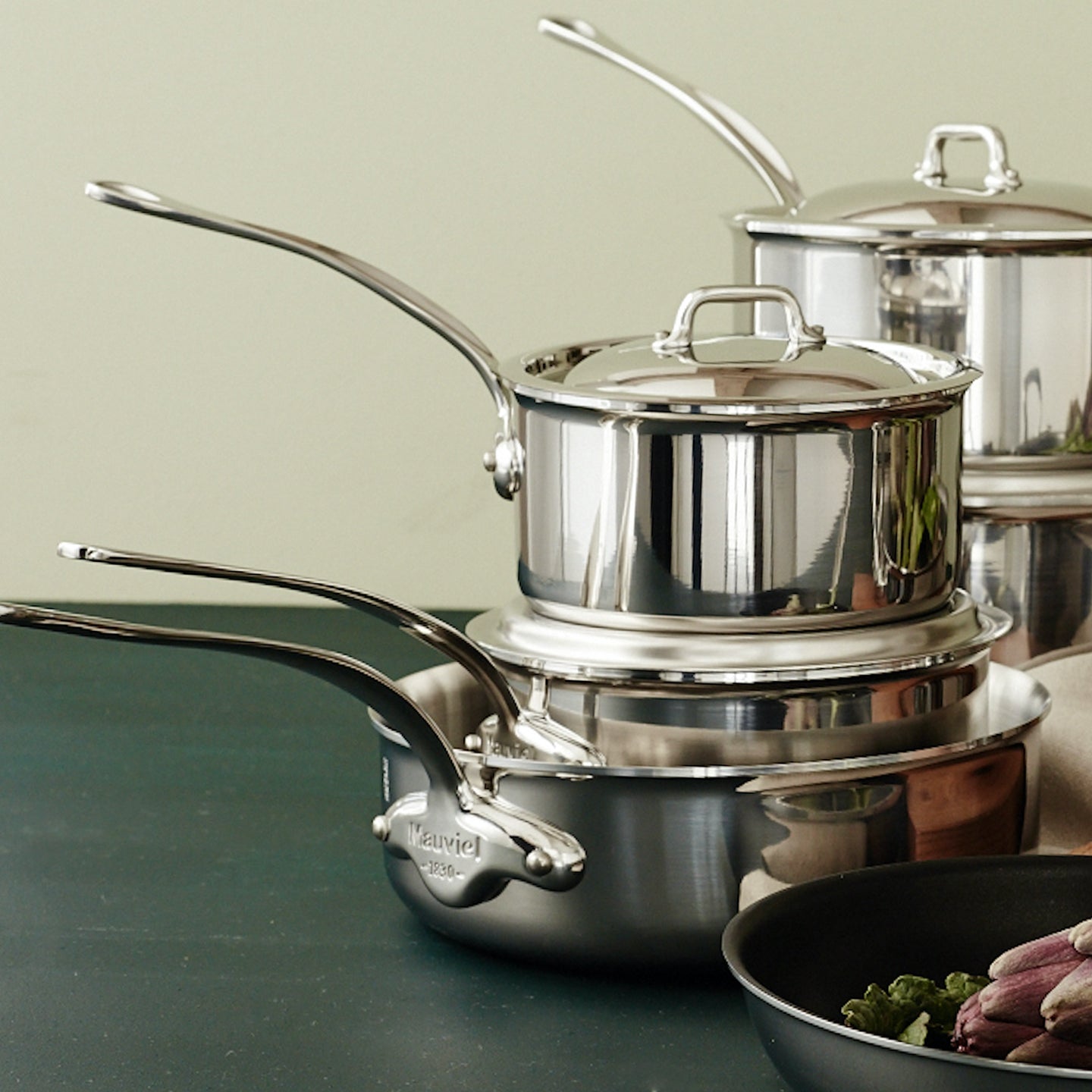 Close-up of Mauviel M'Cook saucepan with heat-resistant lid for cooking